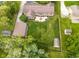 Expansive backyard with lush lawn, patio area, outbuilding, and partial fencing, offering privacy and space at 7135 Lantern Rd, Indianapolis, IN 46256