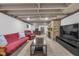 Spacious finished basement featuring a stone fireplace, lounge area, and comfortable seating at 7135 Lantern Rd, Indianapolis, IN 46256