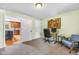 Bedroom with direct access to a modern kitchen, neutral decor, carpet, and natural light at 7135 Lantern Rd, Indianapolis, IN 46256
