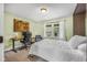 Cozy bedroom featuring neutral decor, carpet, and a peaceful view from the window at 7135 Lantern Rd, Indianapolis, IN 46256