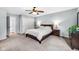 Comfortable bedroom with neutral carpet, closet and an abundance of natural light at 7135 Lantern Rd, Indianapolis, IN 46256