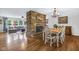 Open floor plan features a dining room area with a stone fireplace and great natural light at 7135 Lantern Rd, Indianapolis, IN 46256