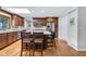Bright kitchen featuring an island with seating, granite countertops, stainless appliances, and a skylight at 7135 Lantern Rd, Indianapolis, IN 46256