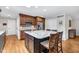 Updated kitchen boasting granite countertops, stainless steel appliances, an island, and ample cabinetry at 7135 Lantern Rd, Indianapolis, IN 46256