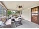 Inviting sunroom featuring wicker furniture, natural light, and a tranquil atmosphere at 7135 Lantern Rd, Indianapolis, IN 46256