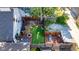 Aerial view of a private fenced backyard with deck, patio, fire pit and mature trees at 715 Terrace Ave, Indianapolis, IN 46203