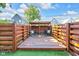 Spacious backyard featuring a wooden deck, privacy fencing, and well-maintained grass at 715 Terrace Ave, Indianapolis, IN 46203
