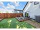 Inviting backyard with a cozy fire pit, outdoor seating, and well-maintained artificial turf at 715 Terrace Ave, Indianapolis, IN 46203