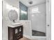 Updated bathroom includes a tiled stand up shower, modern vanity with sink, and new fixtures at 715 Terrace Ave, Indianapolis, IN 46203