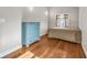 Bright bedroom with hardwood floors and ample natural light from the window at 715 Terrace Ave, Indianapolis, IN 46203