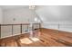 A large bonus room features hardwood floors, and a modern railing at 715 Terrace Ave, Indianapolis, IN 46203