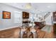 Bright dining room features wood floors, a glass table, and dark wood cabinets at 715 Terrace Ave, Indianapolis, IN 46203