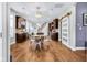 Open-concept dining room with modern lighting and dark wood cabinetry at 715 Terrace Ave, Indianapolis, IN 46203
