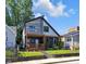 Contemporary two-story home featuring a welcoming front porch and nicely landscaped yard at 715 Terrace Ave, Indianapolis, IN 46203