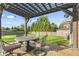 A spacious deck with pergola offers a perfect spot for outdoor dining and relaxation at 7153 N Audubon Rd, Indianapolis, IN 46250