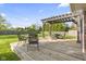 A spacious deck with pergola offers a perfect spot for outdoor dining and relaxation at 7153 N Audubon Rd, Indianapolis, IN 46250
