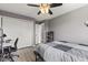 Bedroom featuring wood-look flooring, neutral walls, and a ceiling fan at 7153 N Audubon Rd, Indianapolis, IN 46250