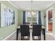 Formal dining room with bright window and chandelier lighting at 7153 N Audubon Rd, Indianapolis, IN 46250