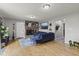 Comfortable living area featuring a brick fireplace, stylish decor, and hardwood flooring at 7153 N Audubon Rd, Indianapolis, IN 46250