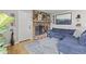 Living room with fireplace and couch with blue accent rug on the floor at 7153 N Audubon Rd, Indianapolis, IN 46250