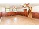 Basement space with partially paneled walls, and two windows at 7250 Hoover Rd, Indianapolis, IN 46260