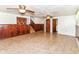Finished basement area with stairs and storage space at 7250 Hoover Rd, Indianapolis, IN 46260