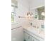 Bathroom featuring a sleek vanity and large mirror at 7250 Hoover Rd, Indianapolis, IN 46260