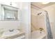 Cozy bathroom with a shower-tub and wall storage at 7250 Hoover Rd, Indianapolis, IN 46260