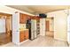 Cozy kitchen with wood cabinets, stainless steel appliances, and bright countertops at 7250 Hoover Rd, Indianapolis, IN 46260