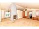 Open living room featuring a unique brick fireplace at 7250 Hoover Rd, Indianapolis, IN 46260
