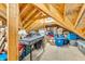 Unfinished attic space with wooden beams, a workbench, and space for storage at 7897 Hickory Ridge Ln, Mooresville, IN 46158