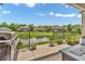 Backyard patio with a lake view, outdoor furniture and gas grill at 7897 Hickory Ridge Ln, Mooresville, IN 46158