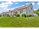 Backyard showcasing well-maintained lawn and exterior of home at 7897 Hickory Ridge Ln, Mooresville, IN 46158