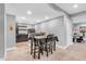 Finished basement features a dining table and wet bar, ideal for entertaining guests in a relaxed setting at 7897 Hickory Ridge Ln, Mooresville, IN 46158