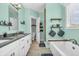 Spa-like bathroom features soaking tub, double sinks, and stylish decor for a relaxing experience at 7897 Hickory Ridge Ln, Mooresville, IN 46158