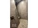 Beautifully tiled shower with unique floor design and modern shower head and faucet fixtures at 7897 Hickory Ridge Ln, Mooresville, IN 46158