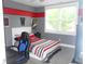 Cozy bedroom featuring a comfortable bed and a bright window view at 7897 Hickory Ridge Ln, Mooresville, IN 46158