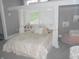 Bedroom with a bed beneath a small loft and a pink beanbag chair at 7897 Hickory Ridge Ln, Mooresville, IN 46158