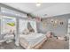 Bright bedroom with a modern loft bed with decorations, carpet, and a large window for ample natural light at 7897 Hickory Ridge Ln, Mooresville, IN 46158
