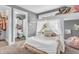 Bright and airy bedroom with a bed with white and beige coverings and an ensuite bathroom at 7897 Hickory Ridge Ln, Mooresville, IN 46158