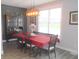 Cozy dining room featuring a stylish light fixture, table and seating with an accent wall at 7897 Hickory Ridge Ln, Mooresville, IN 46158