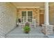 Inviting front porch with two rocking chairs, perfect for enjoying the outdoors at 7897 Hickory Ridge Ln, Mooresville, IN 46158