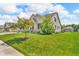 Well maintained lawn and landscaping showcasing a lovely brick home at 7897 Hickory Ridge Ln, Mooresville, IN 46158