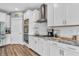 Modern kitchen featuring stainless steel appliances, white cabinets, and granite countertops at 7897 Hickory Ridge Ln, Mooresville, IN 46158