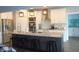 Modern kitchen featuring stainless steel appliances, granite countertops, an island with barstools, and pendant lights at 7897 Hickory Ridge Ln, Mooresville, IN 46158