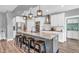 Modern kitchen featuring a large center island, pendant lighting, and stainless steel appliances at 7897 Hickory Ridge Ln, Mooresville, IN 46158