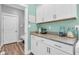 Laundry area with granite counters and ample cabinet space, combining utility with style at 7897 Hickory Ridge Ln, Mooresville, IN 46158