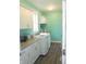 Well-lit laundry room featuring granite countertops, ample cabinet space, and modern appliances at 7897 Hickory Ridge Ln, Mooresville, IN 46158