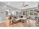 Spacious living room featuring a cozy sofa and large windows with natural lighting at 7897 Hickory Ridge Ln, Mooresville, IN 46158