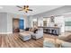 Open-concept living area seamlessly connects the living room and kitchen, perfect for entertaining at 7897 Hickory Ridge Ln, Mooresville, IN 46158